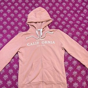 Light pink oversized zip-up hoodie by the brand Reflex in size XL.
